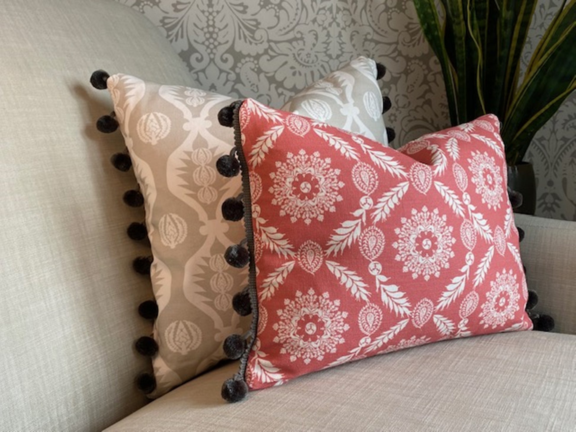 Rosie fabric red cotton cushion with grey pompom trim plus Georgie fabric grey cushion with grey pompom trim