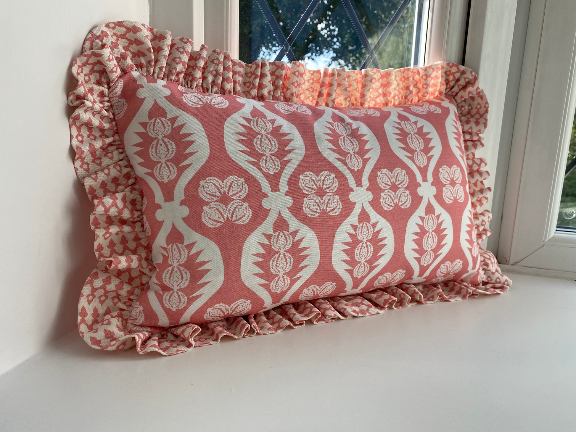 pink frilly cushion. Charlotte Gaisford fabric