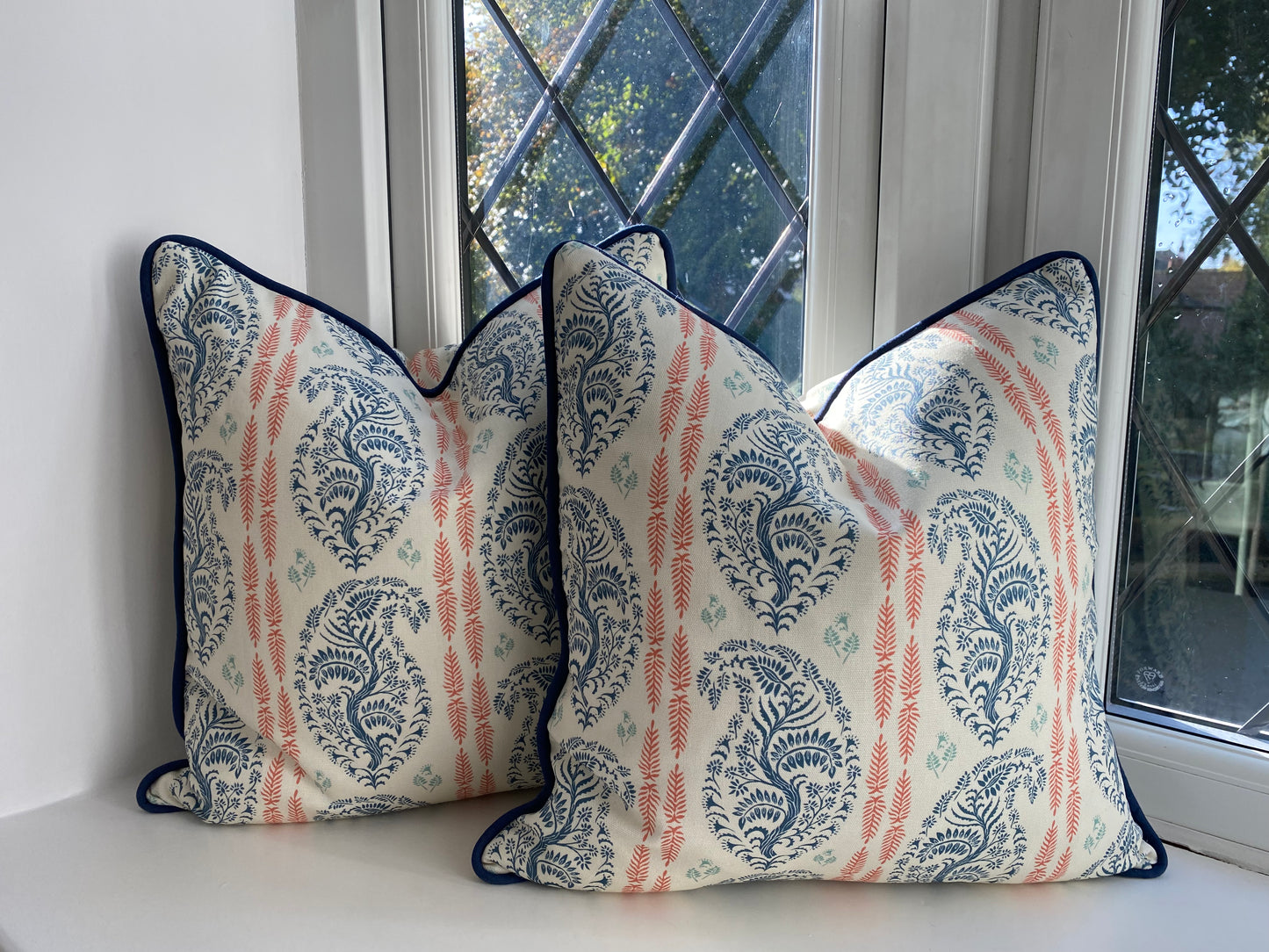 Larisa fabric blue and coral cotton piped cushions