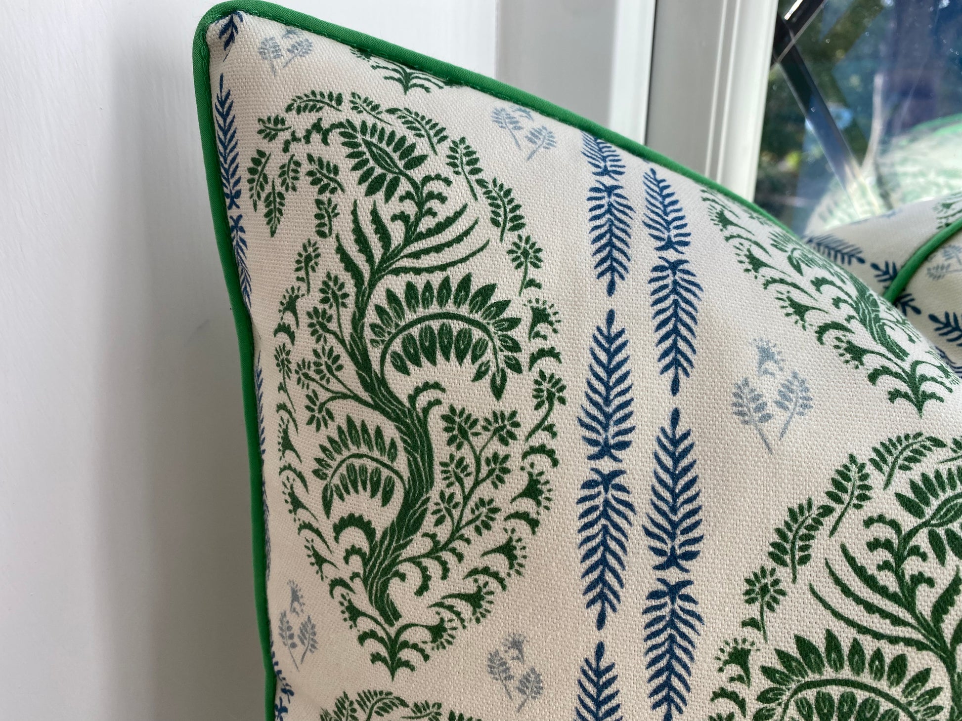 Larisa fabric green and blue cotton piped cushion close up