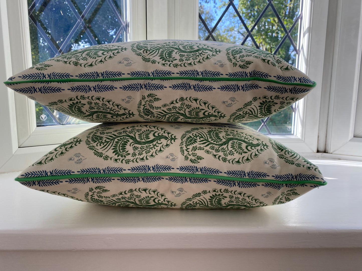 Larisa fabric green and blue cotton piped cushions stack