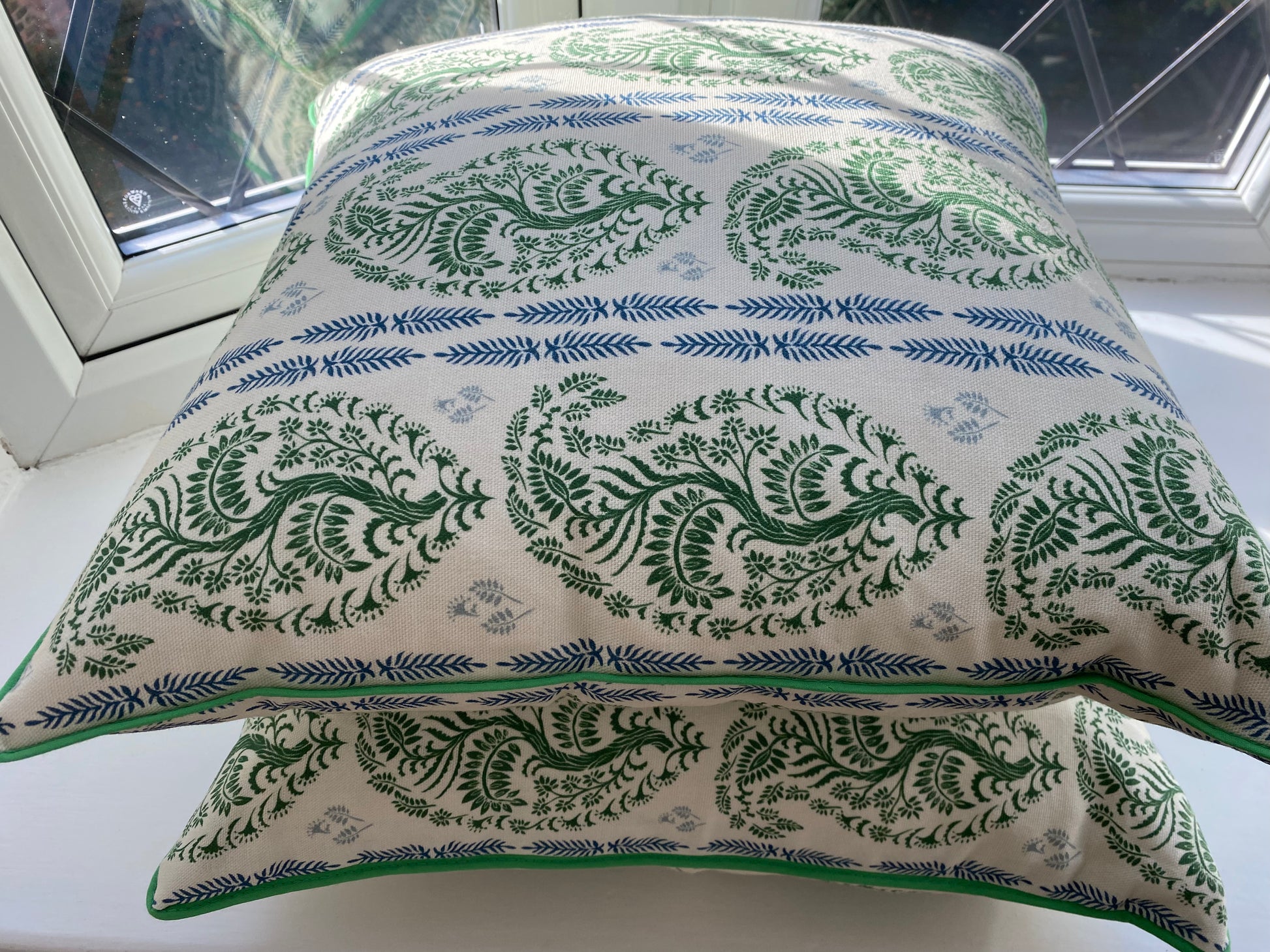 Larisa fabric green and blue cotton piped cushions stack