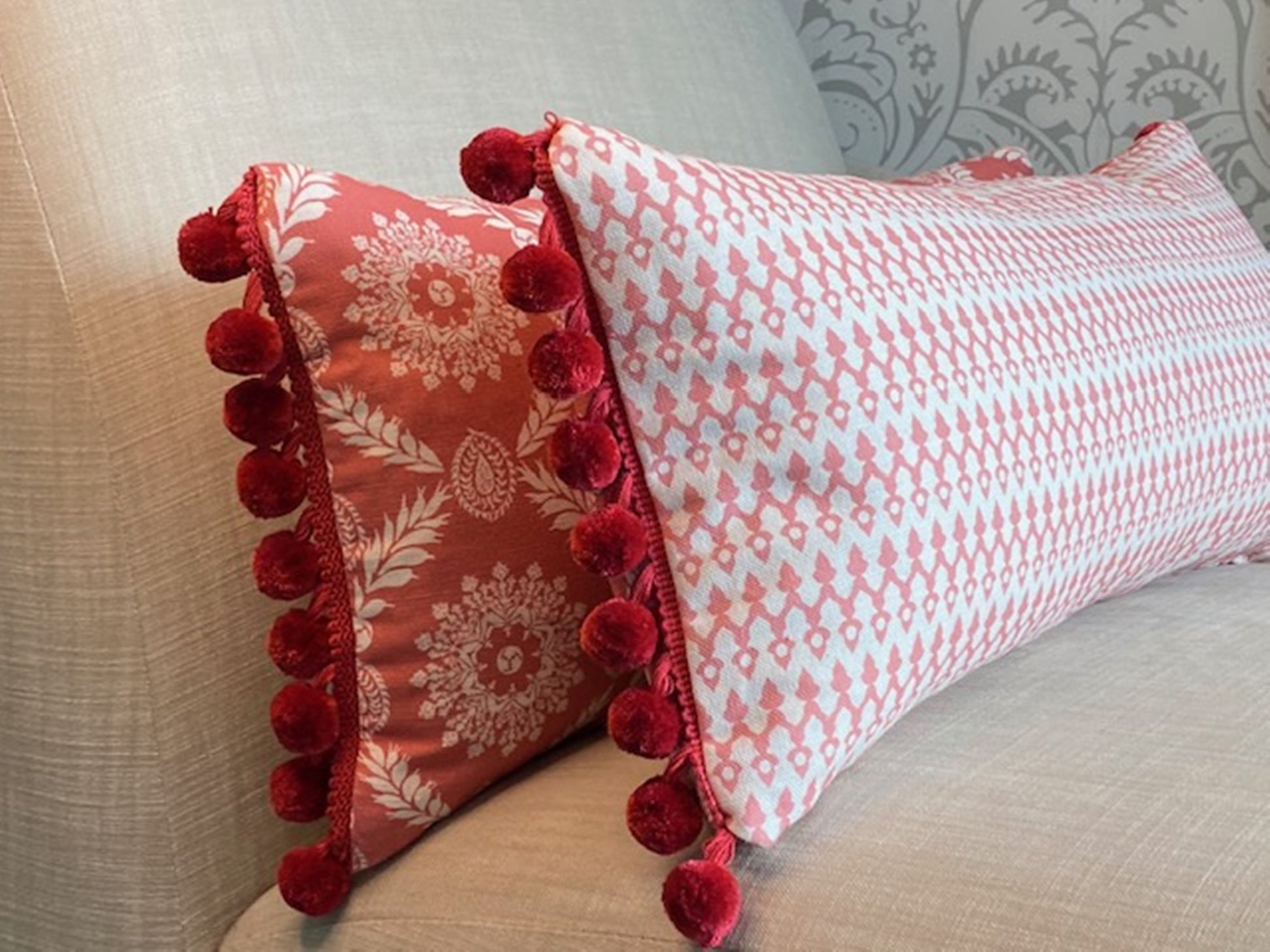 Pair of Rosie fabric red cotton cushions with red pompom trim reverse side Tea4Two fabric pink