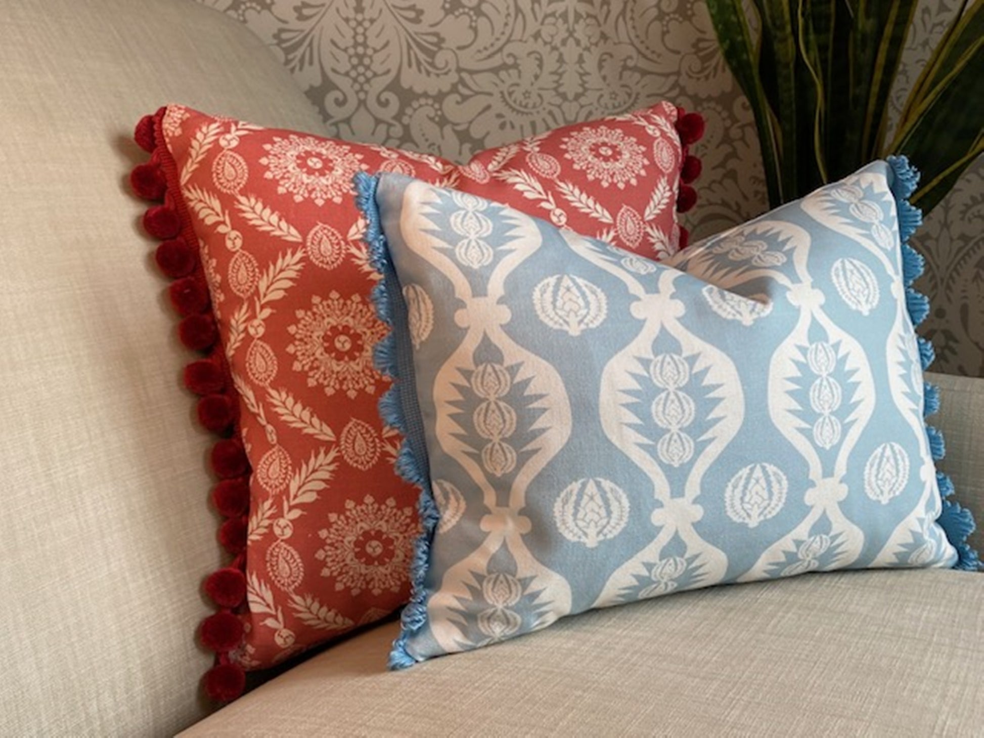 Georgie fabric Blue and white cotton cushion with matching fan trim plus Rosie fabric red cushion with pompom trim