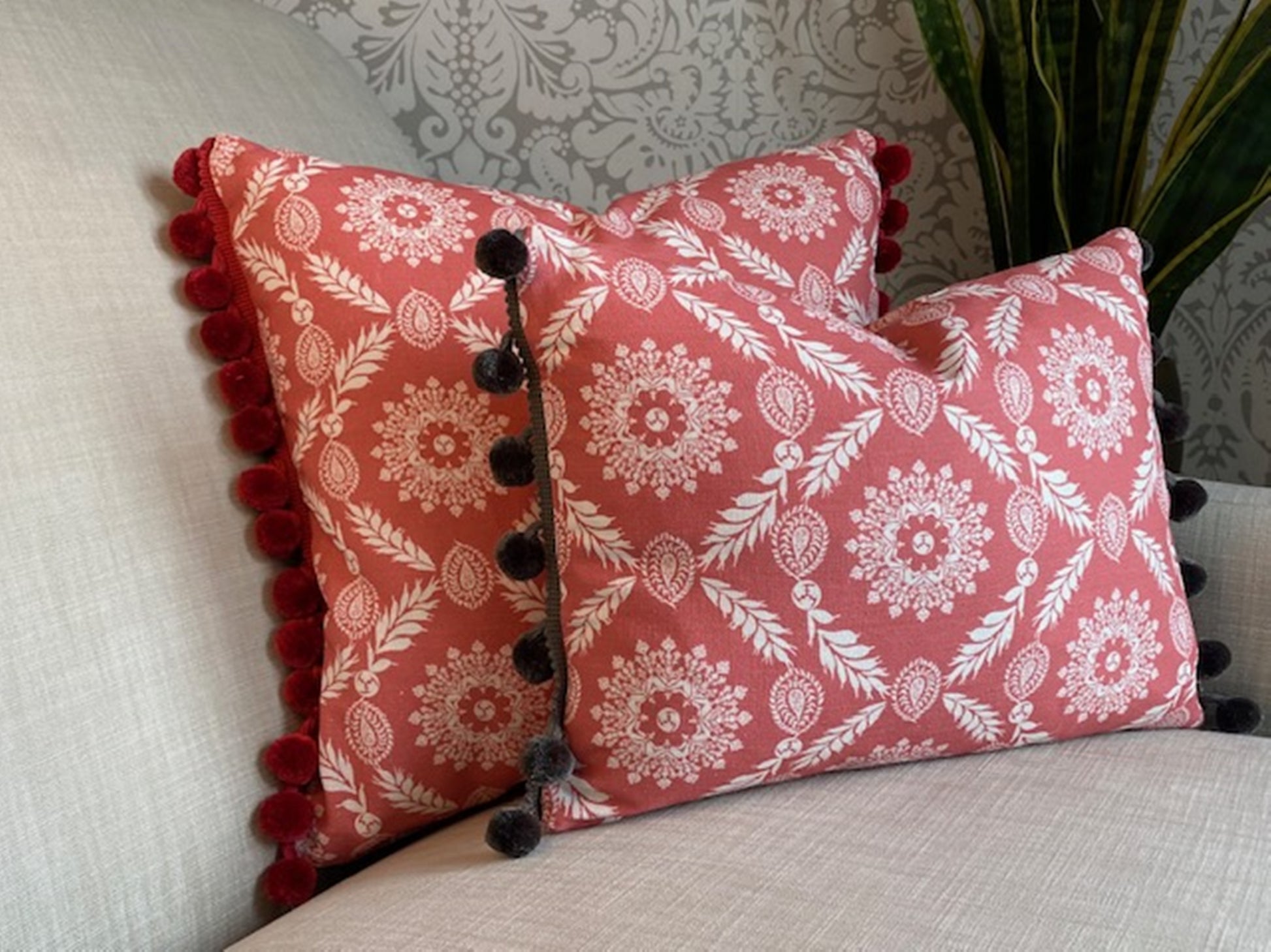 Rosie fabric red cotton cushions with pompom trims