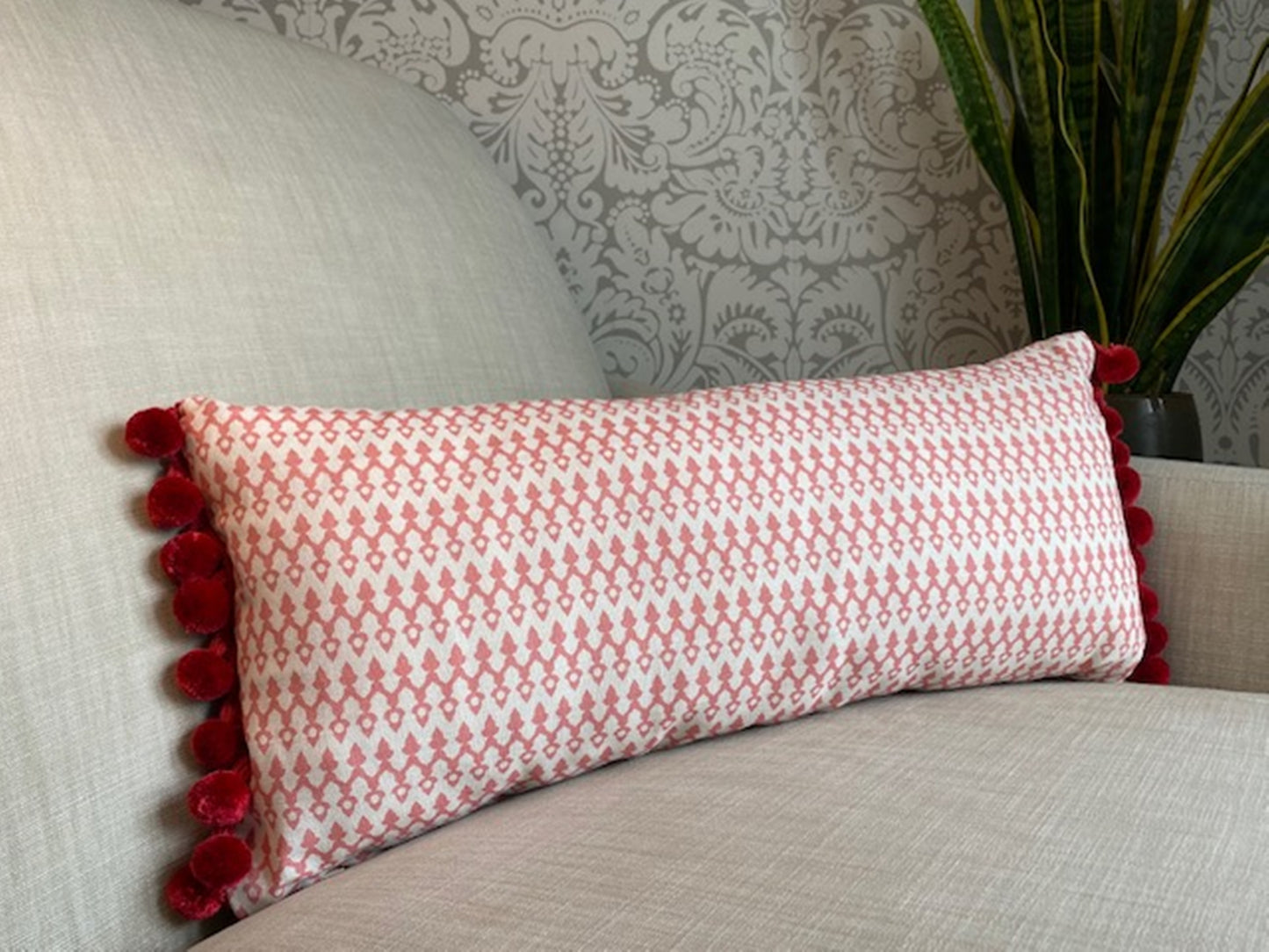 Tea4Two fabric red cotton cushion with red pompom trim