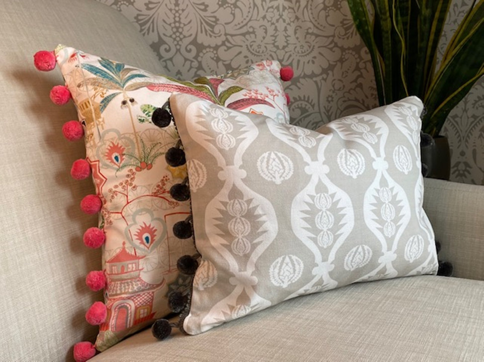 Tiger fabric multi coloured cotton cushion with pompom trim plus Georgie fabric grey cushion with grey pompom trim