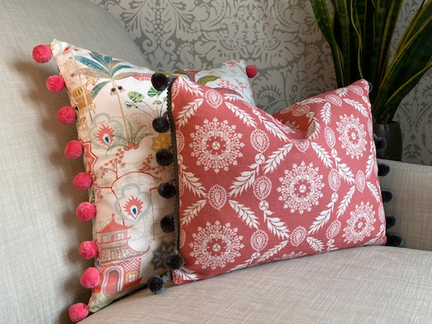 Rosie fabric red cotton cushion with grey pompom trim plus Tiger fabric multi cushion with pompom trim