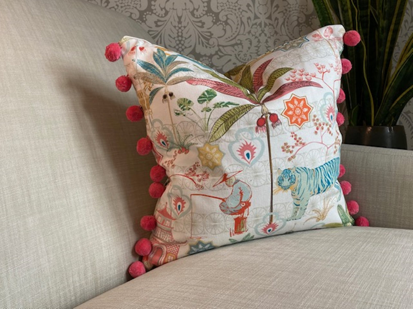 Tiger fabric multi coloured cotton cushion with pompom trim